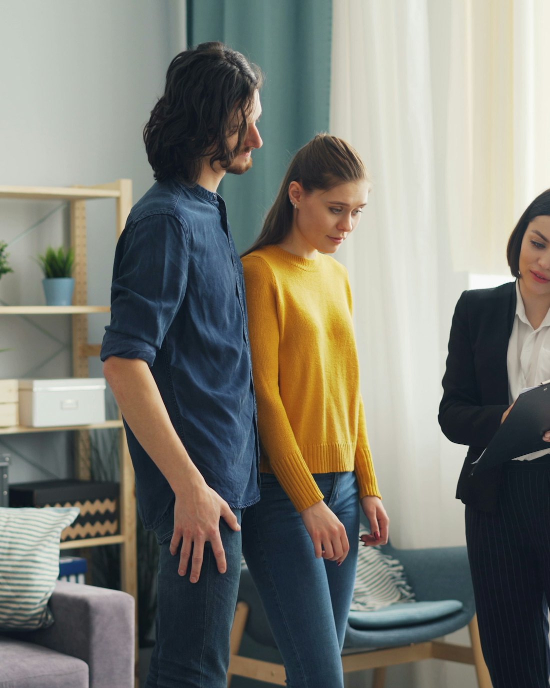 Homeowners talking with a service professional